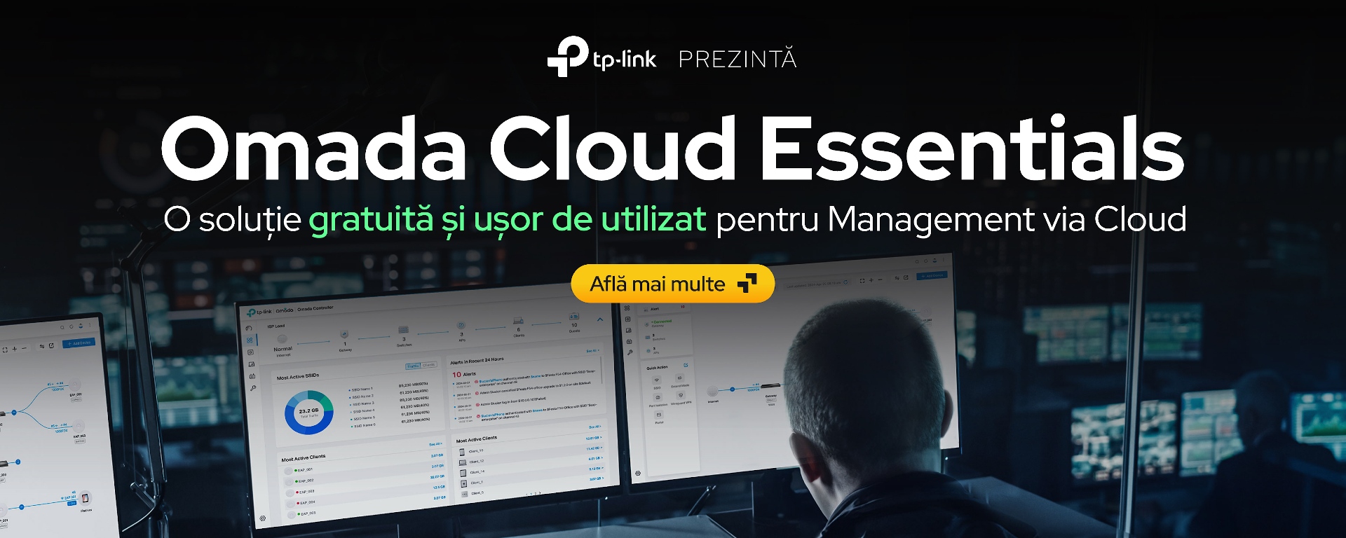 Persoană în fața unui calculator cu interfața Omada Cloud Essentials pe monitoare