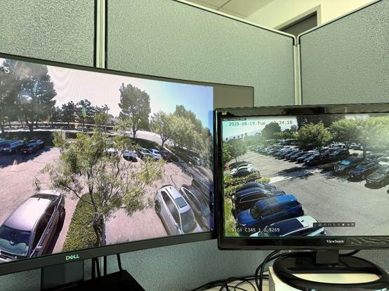 Alt text: VIGI PC Client running on a PC with two monitors, each showing different camera feeds.