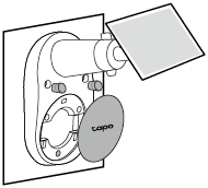 Illustration showing the camera’s decorative cover being attached to the mounting base after installation, aligning it over the screw area for a clean finish.