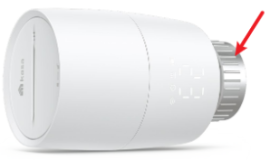 Close-up view of the KE100 smart radiator valve, with an arrow highlighting the valve interface used to connect the device to the radiator.