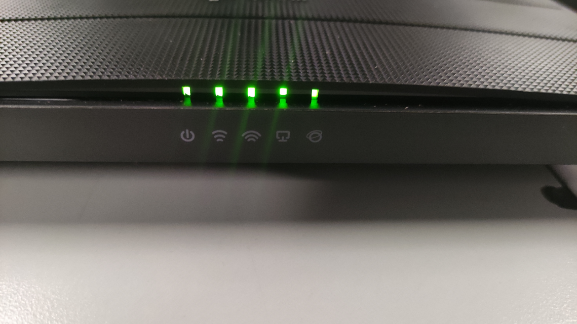 Archer C80 V1 router with Power light blinking rapidly while other lights remain on.