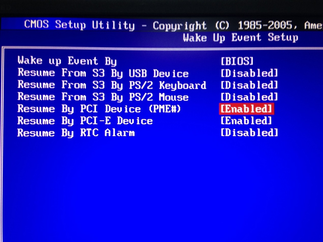 CMOS Setup Utility Wake Up Event Setup screen with Resume By PCI Device (PME#) highlighted as Enabled.