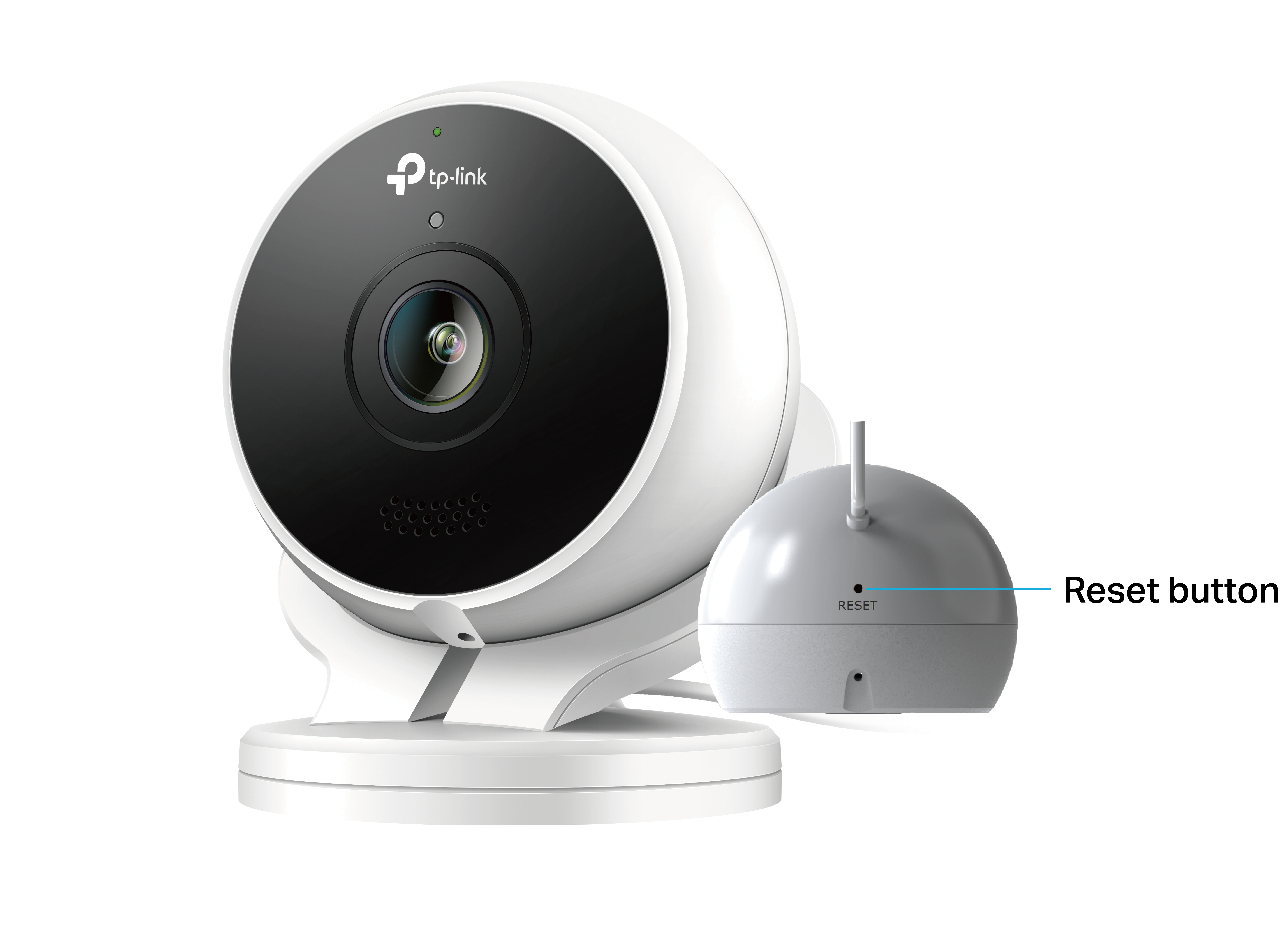 Photo of a Kasa wired outdoor security camera with an arrow pointing to the Reset button on the back, with the magnetic mount removed.
