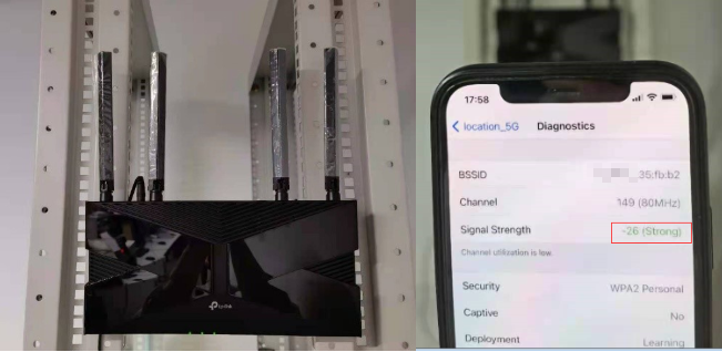 TP-Link router on a shelf placing vertically next to iPhone Diagnostics screen showing Signal Strength -26 (Strong) highlighted.