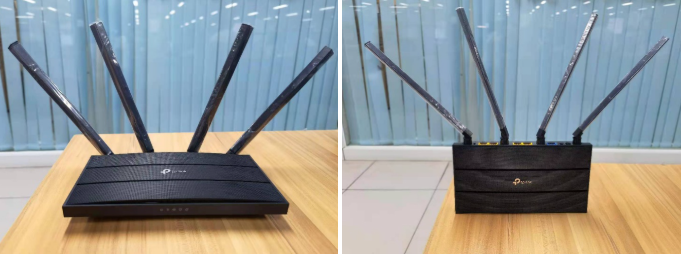 Side-by-side of TP-Link router with antennas all vertical versus antennas spread at angles on a wooden table.