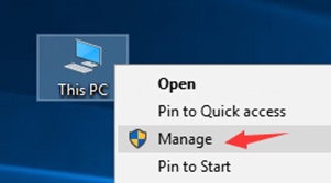 Windows desktop right-click context menu on This PC with Manage option highlighted by an arrow.
