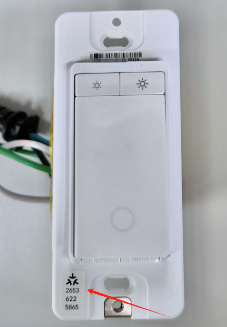 A picture showing the Matter Pairing Code located in switch’s side of the casing near the button.
