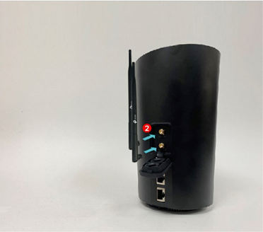 Two external antennas being attached to the back of a black Deco 4G/5G router, labeled step 2.