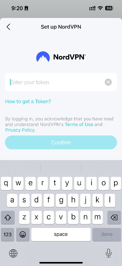 Set up NordVPN token entry screen with keyboard open and Confirm button.