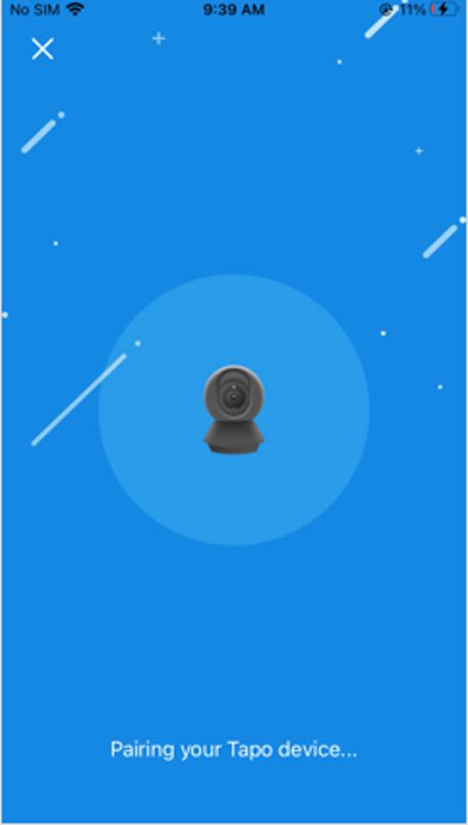 Kopplungsbildschirm der Tapo-App mit Kamerasymbol und der Meldung „Ihr Tapo-Gerät wird gekoppelt …“ auf blauem Hintergrund.