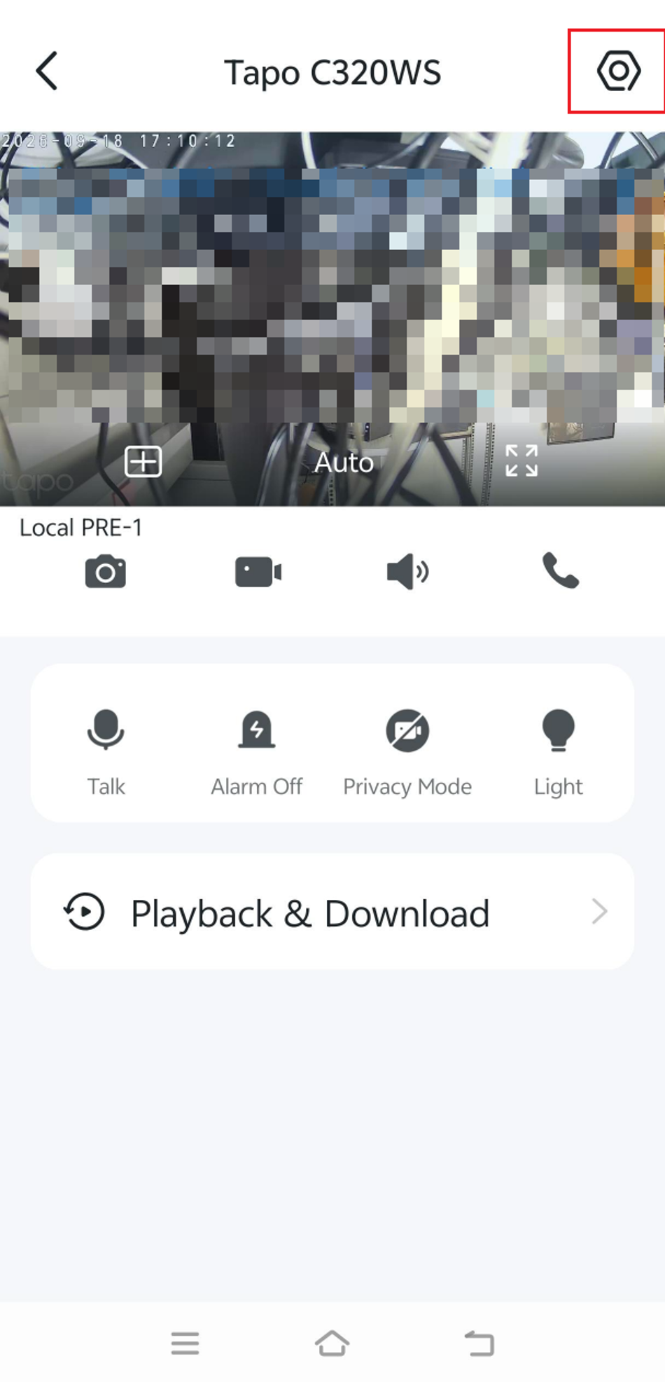 Tapo App live view screen on a smartphone, showing the camera feed with the Settings icon highlighted in the top-right corner for access.