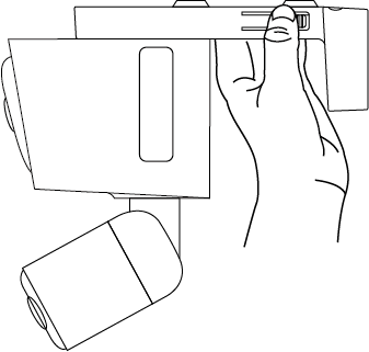 Displays how to press the two release latches to detach the camera from the bracket.